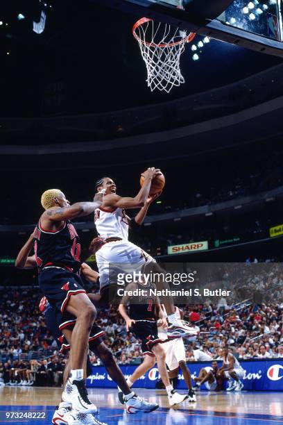 Allen Iverson of the Philadelphia 76ers shoots against the Chicago Bulls during a game played on April 17, 1998 at the First Union Arena in...