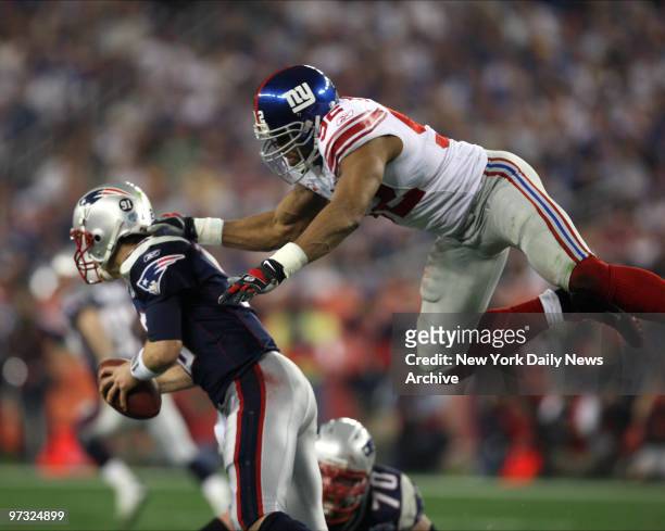 Super Bowl 42 between New York Giants and New England Patriots at University of Phoenix Stadium in Glendale, AZ. Michael Strahan sacks Tom Brady...
