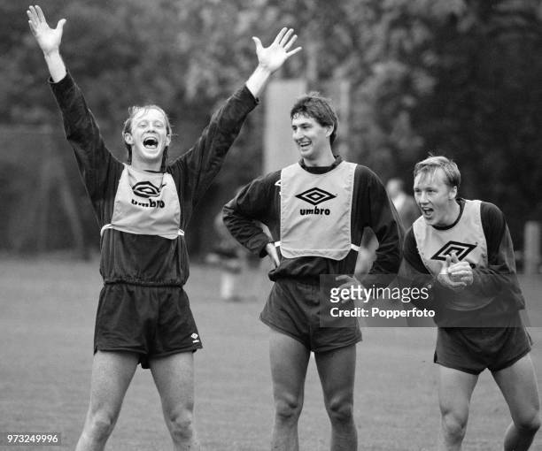 England footballers Mark Wright , Tony Adams and Lee Dixon during training at Bisham Abbey on October 15, 1990 in Bisham, England.