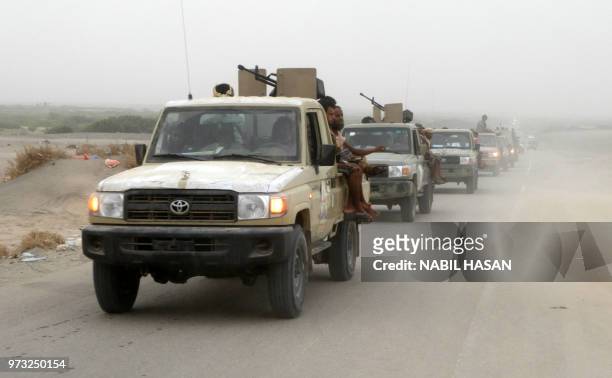 Column of Yemeni pro-government forces arrives in al-Durayhimi district, about nine kilometres south of Hodeidah international airport on June 13,...