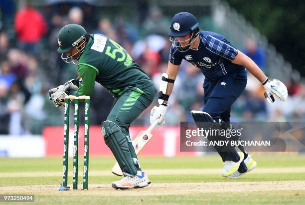 Pakistan's Sarfraz Ahmed takes with wicket of Scotland's Mark Watt during the second Twenty20 International cricket match between Scotland and...