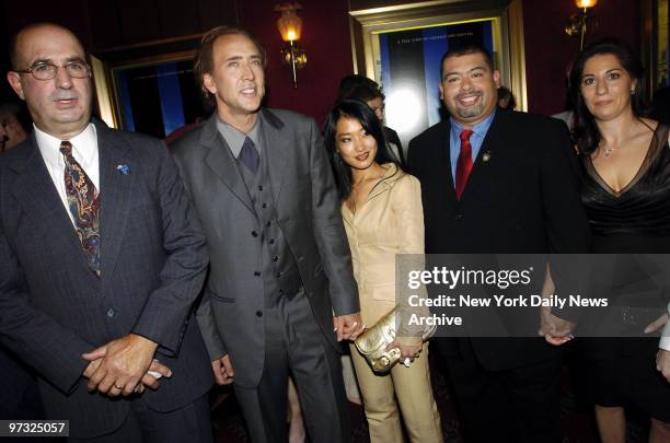 Nicolas Cage and his wife, Alice Kim, are joined by Port Authority Police Officers John McLoughlin and William J. Jimeno and Jimeno's wife, Allison,...