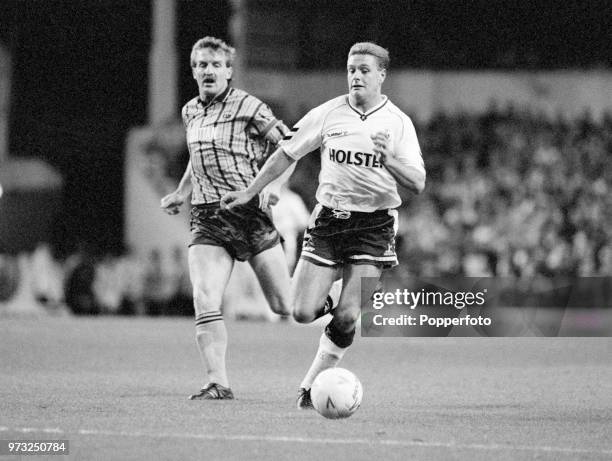 Paul Gascoigne of Tottenham Hotspur is chased by Robbie James of Bradford City during a Rumbelows League Cup 3rd Round tie at White Hart Lane on...