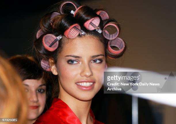 Supermodel Adriana Lima with her hair in curlers backstage before the Victoria's Secret Fashion Show at Bryant Park.