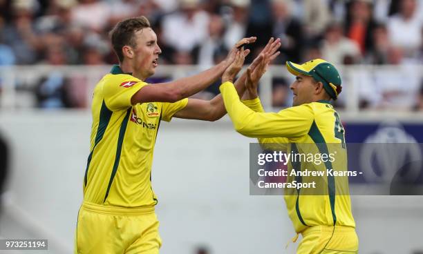 Australia's Billy Stanlake celebrates with his team mate Ashton Agar after taking the wicket of England's Joe Root during the Royal London 1st ODI...