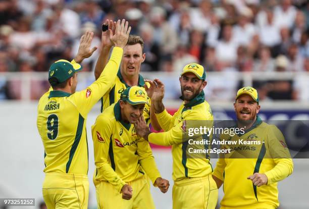 Australia's Billy Stanlake celebrates with his team mates after taking the wicket of England's Joe Root during the Royal London 1st ODI match between...