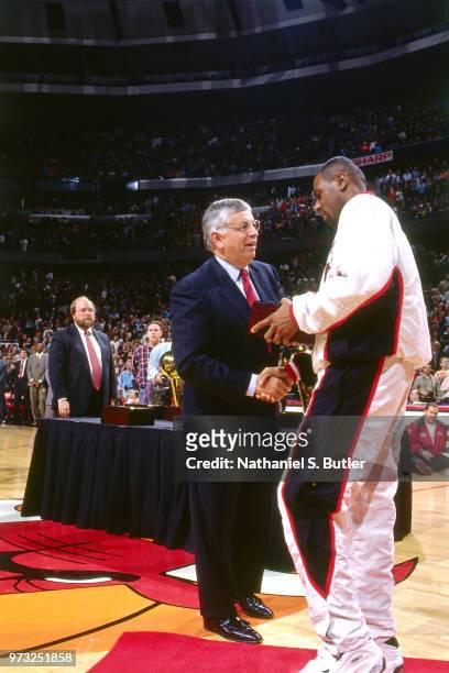 Commissioner David Stern presents Randy Brown of the Chicago Bulls with a championship ring during a game played on November 1, 1997 at the First...