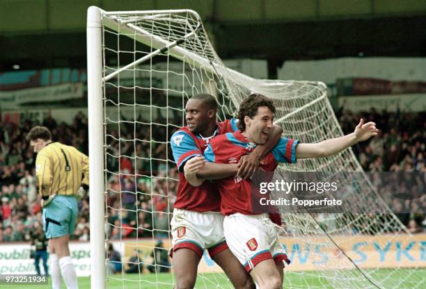 Dean Saunders of Aston Villa celebrates with teammate Dalian Atkinson after scoring during the FA Premier League match between Aston Villa and...