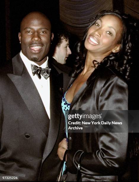 Denver Broncos' Terrell Davis gets together with model Beverly Peele at party at the Four Seasons following presentations of the Espy Awards. Davis...