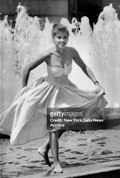 Vanessa Williams, Miss NY State im the Miss America Contest on 1983 cools her feet as she wades in the Metropoliran Museum of Art fountain.