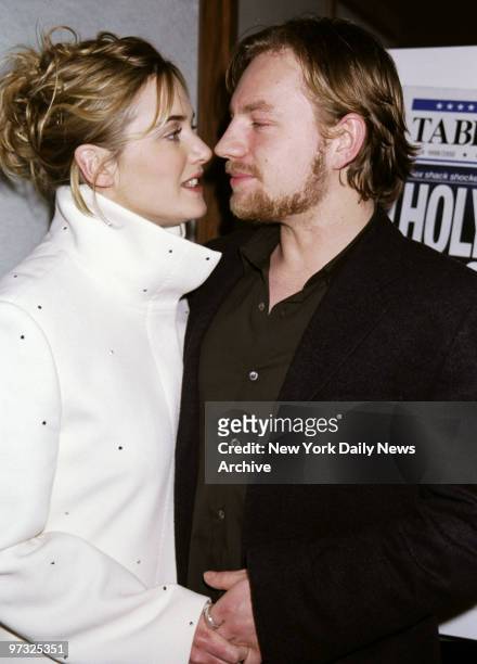 Kate Winslet does a close-up with her husband, James Threapleton, at the premiere party at Nicole's for the movie "Holy Smoke." She stars in the film.