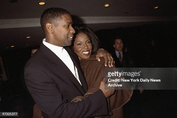 Denzel Washington and his wife attending premiere of "The Preacher's Wife" at Roseland.,