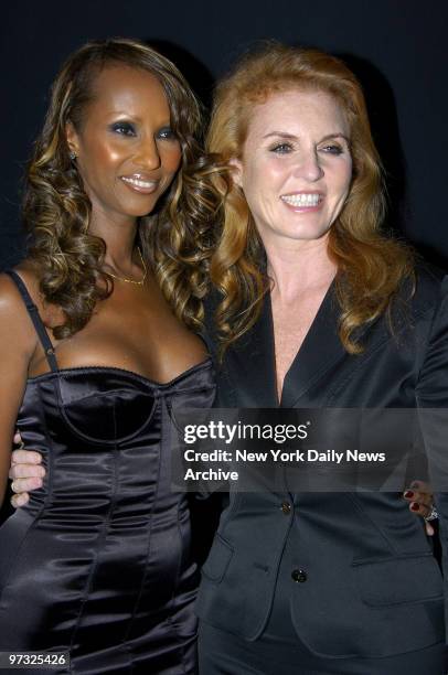 Supermodel Iman gets together with Sarah Ferguson, the Duchess of York, backstage during the Fashion for Relief runway show at the tents in Bryant...