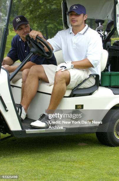 Nick Lachey gives brother Drew a ride around the course at the Tommy Hilfiger Corporate Foundation's fourth annual All-American Golf Classic at...