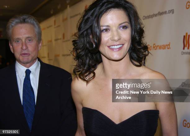 Michael Douglas and wife Catherine Zeta-Jones are on hand for the Christopher Reeve Foundation's "A Magical Evening" reception and dinner at the New...
