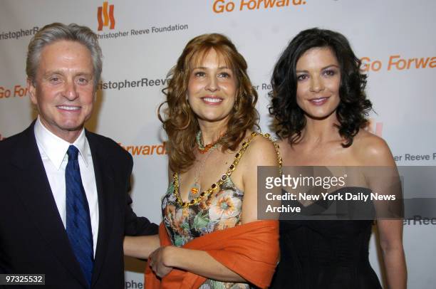 Michael Douglas and wife Catherine Zeta-Jones flank Dana Reeve, Christopher Reeve's widow, during the Christopher Reeve Foundation's "A Magical...