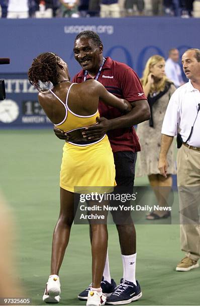 Venus Williams gets a big hug from her father, Richard, after she defeated Lindsay Davenport to win the U.S. Open title in Flushing Meadows.