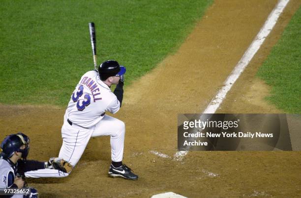 New York Mets' Bubba Trammell hits a sacrifice fly, scoring Joe McEwing and bringing the score to 4-2 in favor of the Mets, during Game 3 of the...