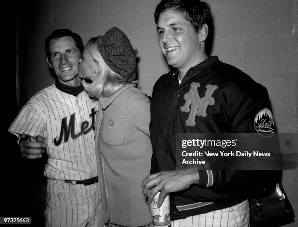 New York Mets' Bud Harrelson and Tom Seaver, along with Seaver's wife Nancy, celebrate Seaver's consectutive strikeout record and new day-game record...