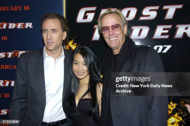 Nicolas Cage , his wife Alice, and Peter Fonda attend the World Premiere of the movie "Ghost Rider," held at the Regal E-Walk Theater in Times...