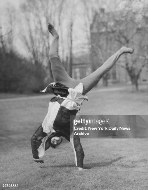 Katherine Lascelle of Westbury, L.I., as a jester, doing cartwheels during Mt. Holyoke College outdoor frolic.