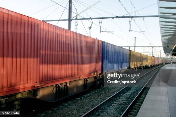 freight train with cargo containers - godståg bildbanksfoton och bilder