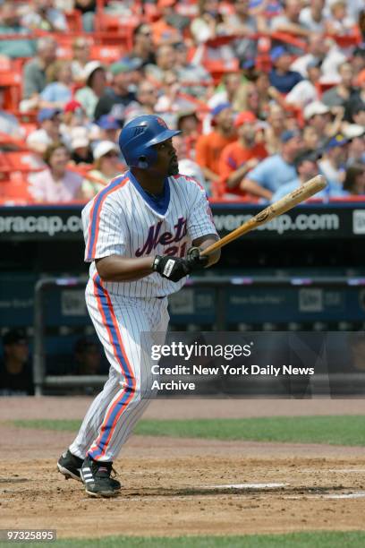 New York Mets' Carlos Delgado hits a solo homer in the second inning of a game against the Colorado Rockies at Shea Stadium. The Mets, who wore...
