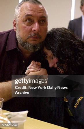 Michael Esposito Jr. , father of Staten Island ferry accident victim, Paul Esposito, comforts nurse Kerry Griffiths at University Hospital....