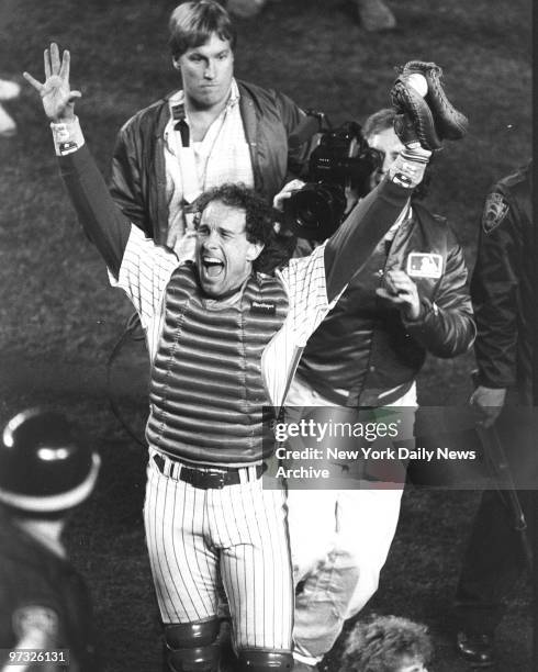 New York Mets' catcher Gary Carter raises his hands in celebration of the Mets 8-5 victory over the Boston Red Sox in Game Seven of the 1986 World...