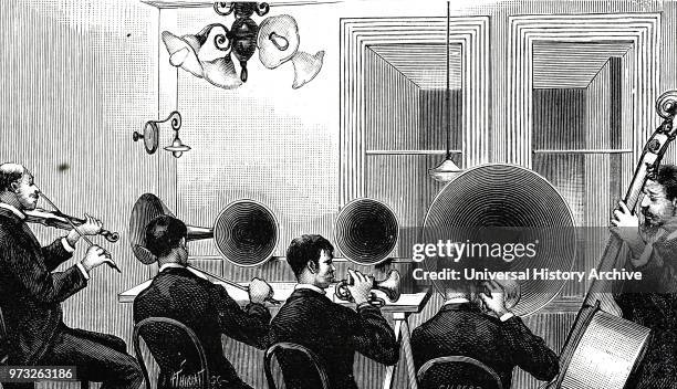 Engraving depicting a quintet playing in New York, playing into four microphones, giving a concert which is being transmitted by telephone to an...