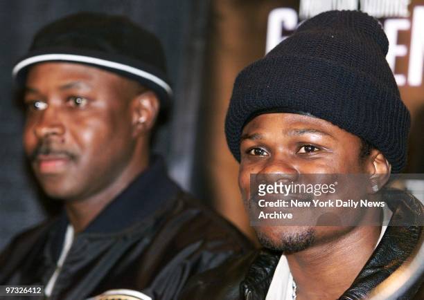 Vernon Forrest sits with his manager Charles Watson during a news conference to announce the welterweight championship fight between Mosley and...