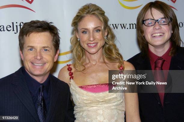 Michael J. Fox, wife Tracy Pollan and their son, Sam get together at "A Funny Thing Happened on the Way to Cure Parkinson's...," a benefit dinner...