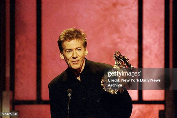 Designer Calvin Klein accepts his award at the GQ Man of the Year awards ceremony at the Beacon Theater.