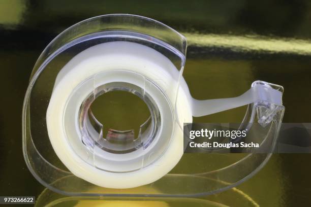 transparent office tape and plastic dispenser - tape dispenser photos et images de collection