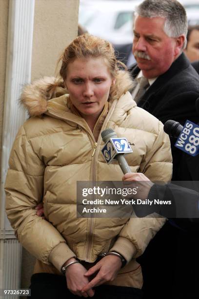 Nicole Pearce is escorted into Nassau County Police detention facility after she was extradited from Atlantic City. She faces charges in the murders...