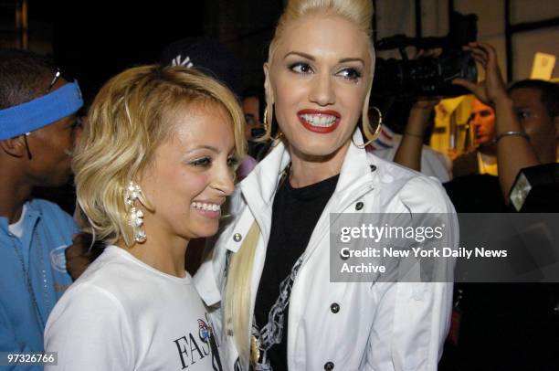 Nicole Richie and Gwen Stefani get together backstage at the Fashion for Relief runway show in the tents at Bryant Park on the last day of Fashion...