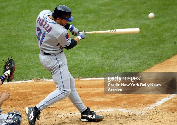 New York Mets' catcher Mike Piazza hits a single to left field to score Hideki Matsui in the fourth inning of game against the New York Yankees at...