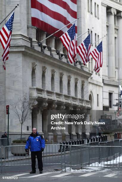 With the country on a Code Orange security alert, barriers are up outside the New York Stock Exchange on Wall St. ,