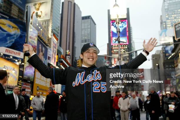 Kazuo Matsui, the New York Mets' new shortstop, wears his new No. 25 jersey during an outing in Times Square. Matsui, a star of Japanese baseball,...