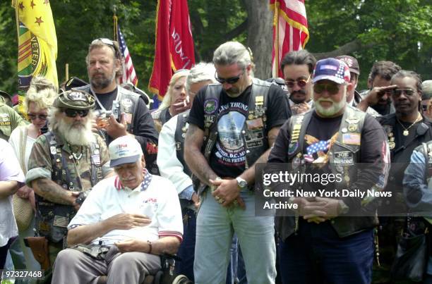 Veterans of the war in Vietnam bow their heads during cremonies at the Memorial Day Parade in Bay Ridge, Brooklyn.