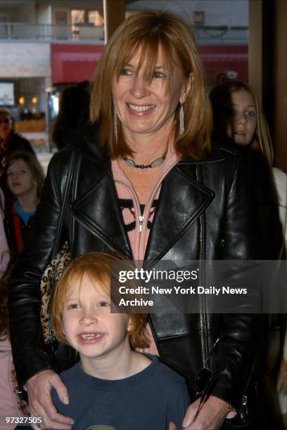 Designer Nicole Miller takes her son, Palmer, to a screening of the movie "The Cat in the Hat" at the UA Cinema Theatre.