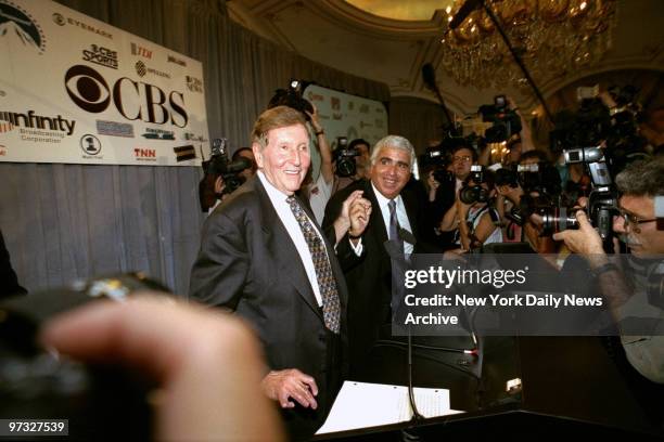 Viacom chairman Sumner Redstone and CBS chief executive Mel Karmazin announcing $38 billion merger of the two companies at news conference at the St....