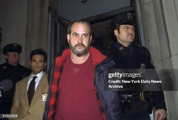 Suspect Timothy Byrne of Hoboken, N.J., is escorted from the Midtown North Precinct by arresting officers Detective Daniel DiPrenda and Police...