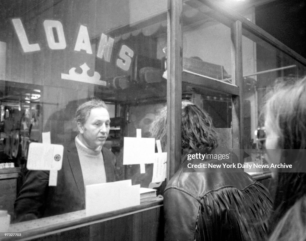 Michael James Brody Jr. looks in on pawnbroker Harry Friedma