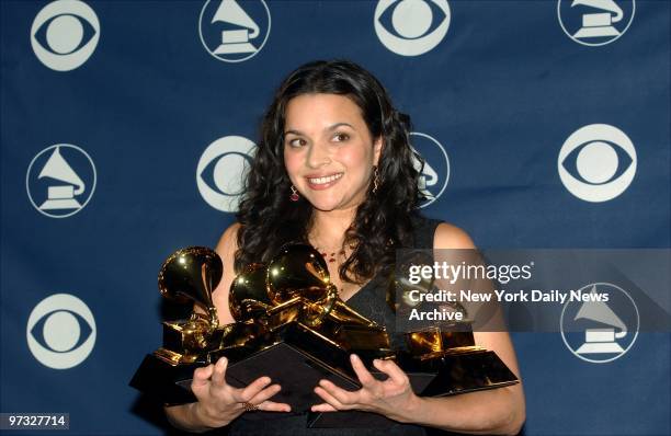 Norah Jones holds her five awards backstage at the 45th annual Grammy Awards at Madison Square Garden. Jones took the honors for Record of the Year;...