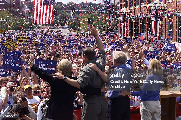 Vice President Al Gore and running mate Joseph Lieberman are joined by their wives, Tipper and Hadassah, as they face a storm of confetti at a...