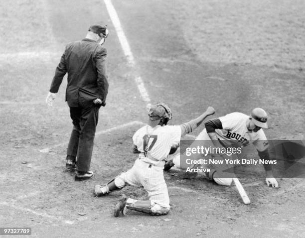 Norm Larker hits the dirt after a close pitch from New York Mets' pitcher Al Jackson during game against the Houston Colt 45s. Catcher is Choo Choo...