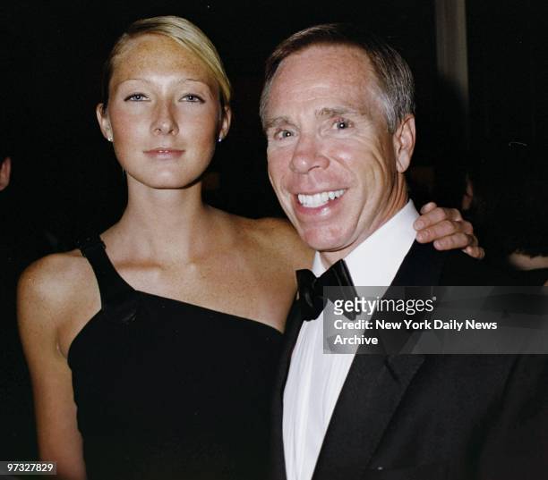 Designer Tommy Hilfiger and model Maggie Rizer are on hand at the Metropolitan Museum of Art for the opening of "Jacqueline Kennedy: The White House...
