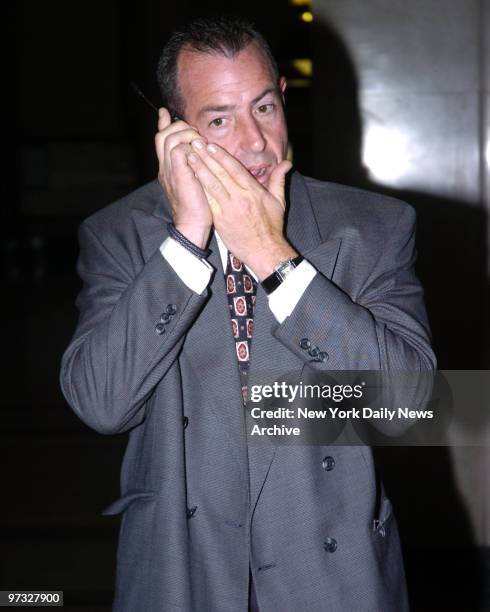 Michael Lohan, father of teen star Lindsay Lohan, talking on cell phone inside Nassau County Court in Mineola. He will stay out of jail by entering...