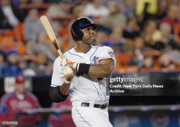 New York Mets' Cliff Floyd hits a solo homer to right in the fourth inning against the Philadelphia Phillies at Shea Stadium. The Mets went on to...